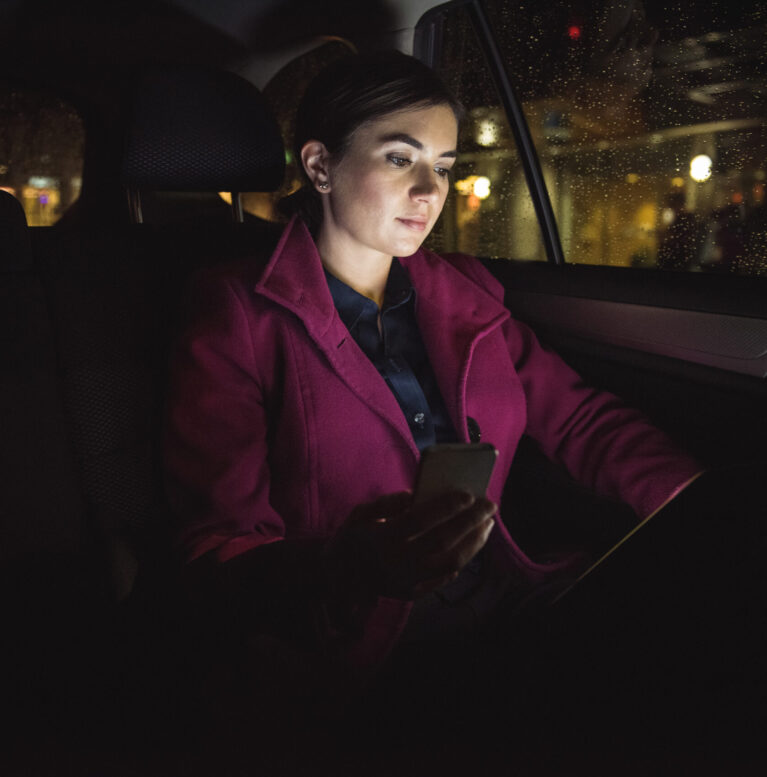 Beautiful businesswoman using digital tablet and phone